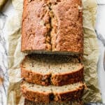 A loaf of our favorite Banana Bread, half of it sliced.