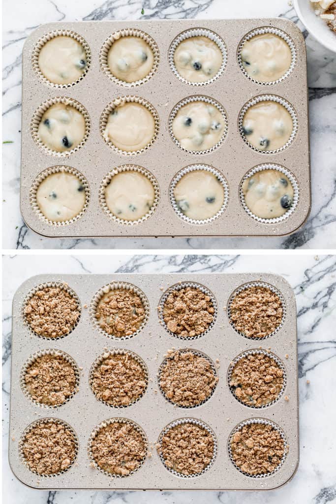 Blueberry muffin batter added to a muffin pan, then crumble topping added on top of each muffin cup.