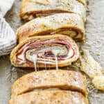 An easy Stromboli recipe, sliced to show the layers inside.