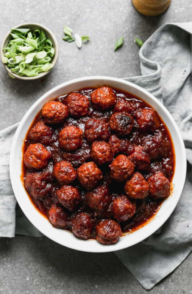 A bowl with BBQ meatball appetizer.