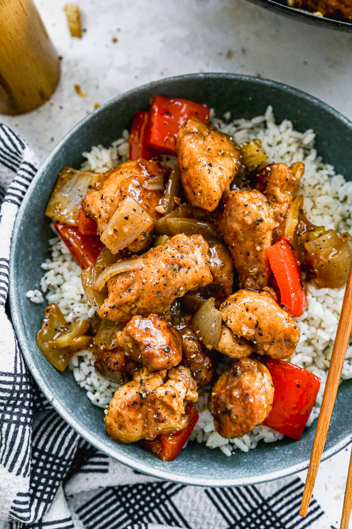 An easy Black Pepper Chicken recipe served over rice, ready to eat. 