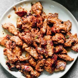 Korean Thin strips of Korean Bulgogi served on a plate.