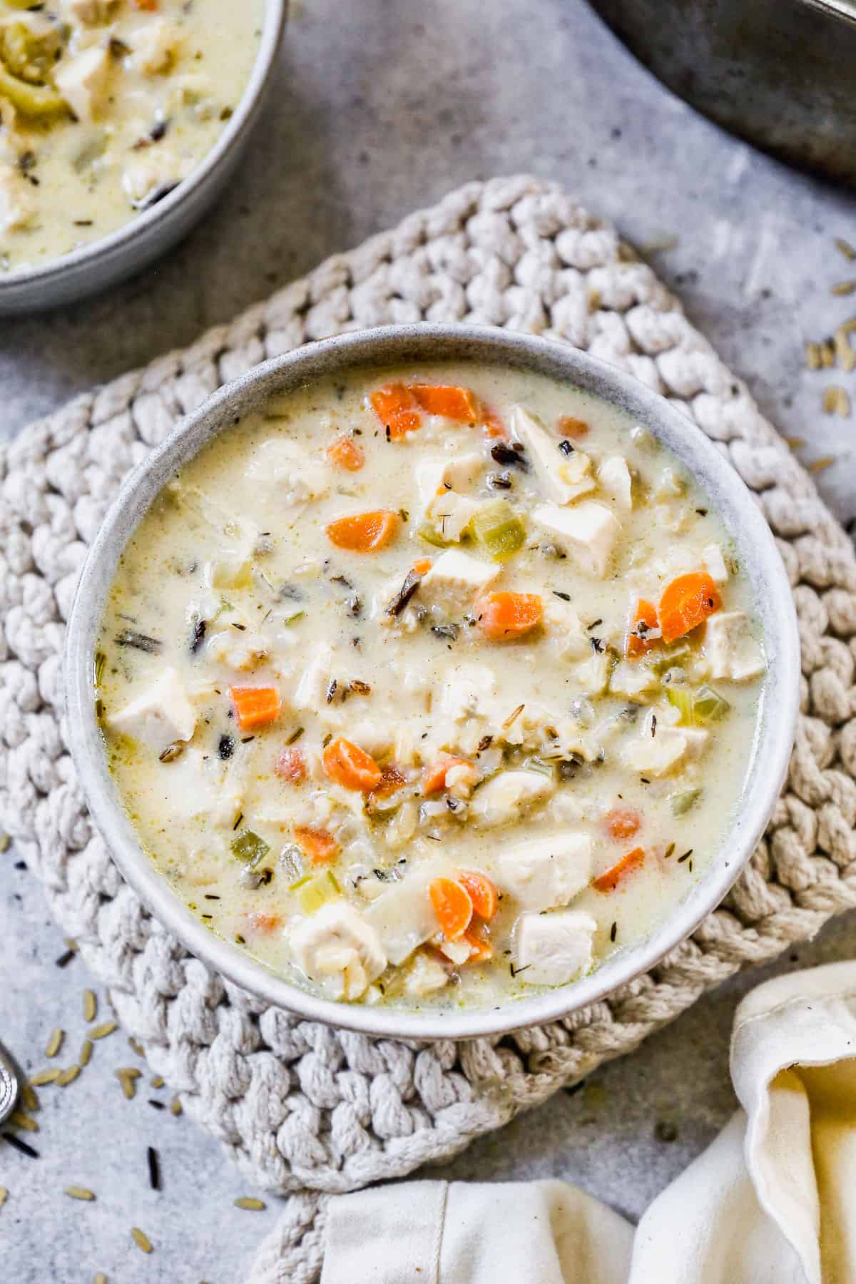 A bowl of creamy Chicken and Wild Rice Soup packed with veggies and ready to enjoy. 