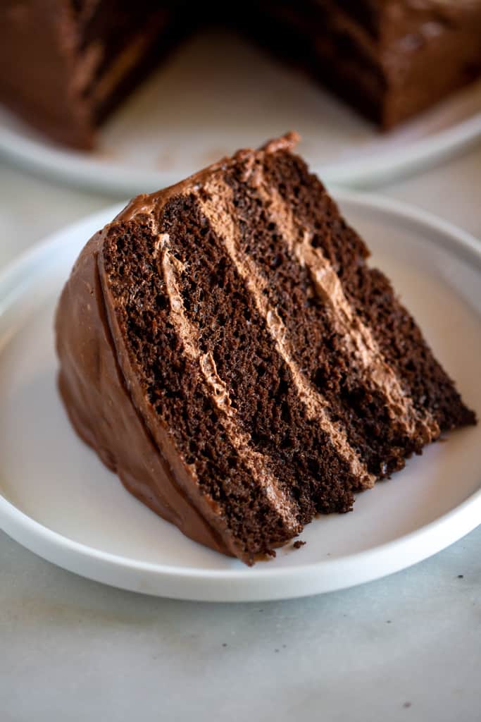 A slice of chocolate mousse cake on a plate.