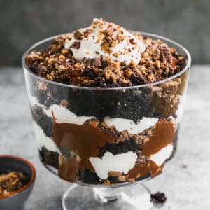 A homemade Chocolate Trifle with chocolate cake, chocolate pudding, crushed heath bars, and whipped cream.