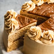 An easy Dulce de Leche Cake recipe with one slice being separated to serve.