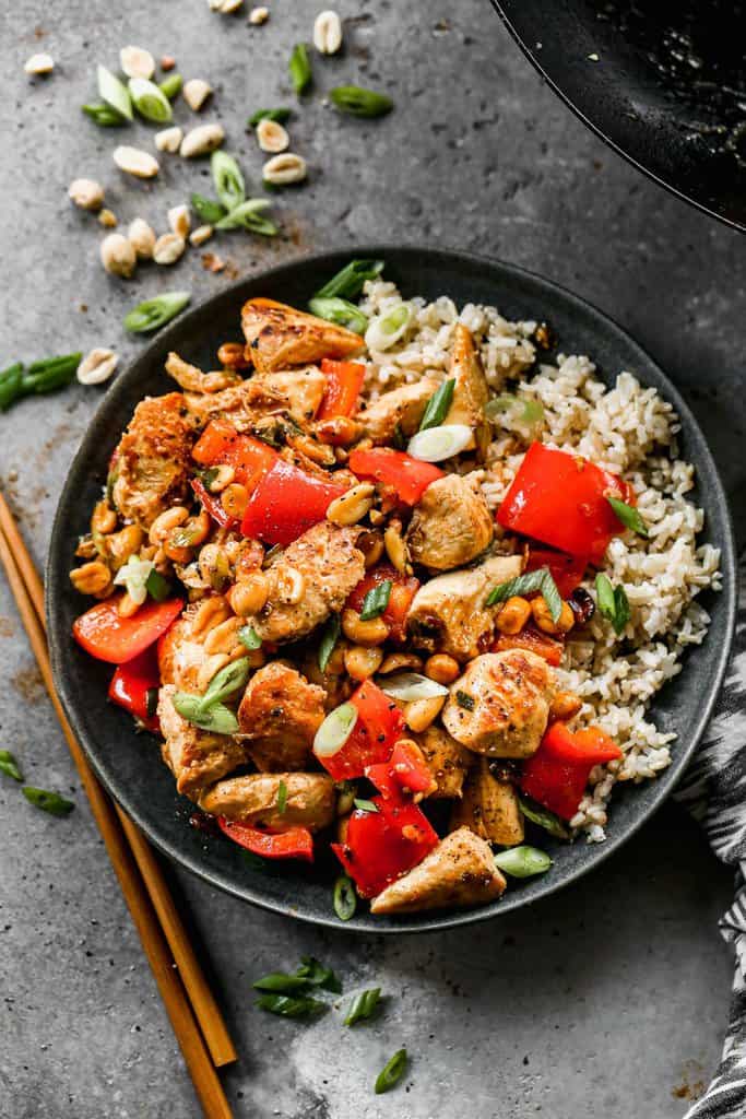 Kung Pao Chicken served on a plate with white rice.