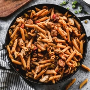 A cajun Pastalaya recipe in a cast iron pan, ready to serve.