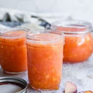 Homemade Peach Jam in glass jars, ready to enjoy!