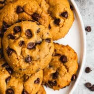 A plate filled with soft pumpkin chocolate chip cookies, ready to enjoy.