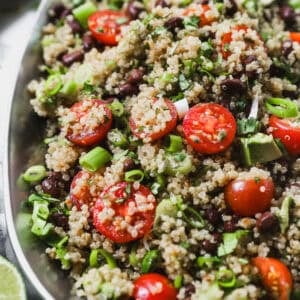 The best Quinoa Salad recipe with fresh tomatoes, herbs, and a light dressing.