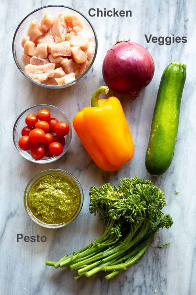 Ingredients for pesto chicken and vegetables.