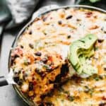 Baked Taco Pie with a spatula lifting a piece out.