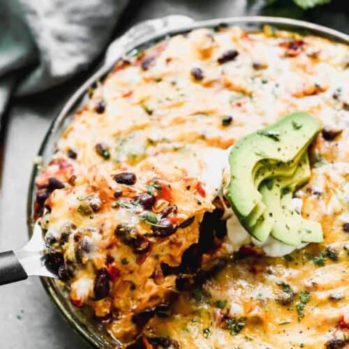 Baked Taco Pie with a spatula lifting a piece out.