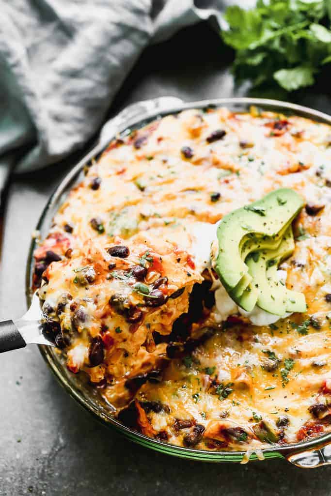 Baked Taco Pie with a spatula lifting a piece out.