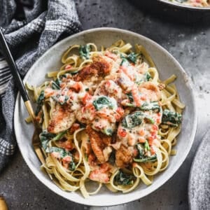 A creamy Tuscan Chicken Pasta recipe in a bowl, ready to enjoy.