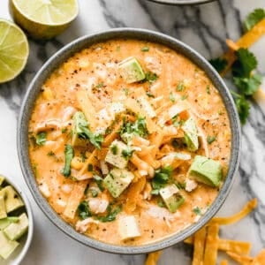 A bowl of creamy White Chicken Chili with toppings, ready to enjoy.